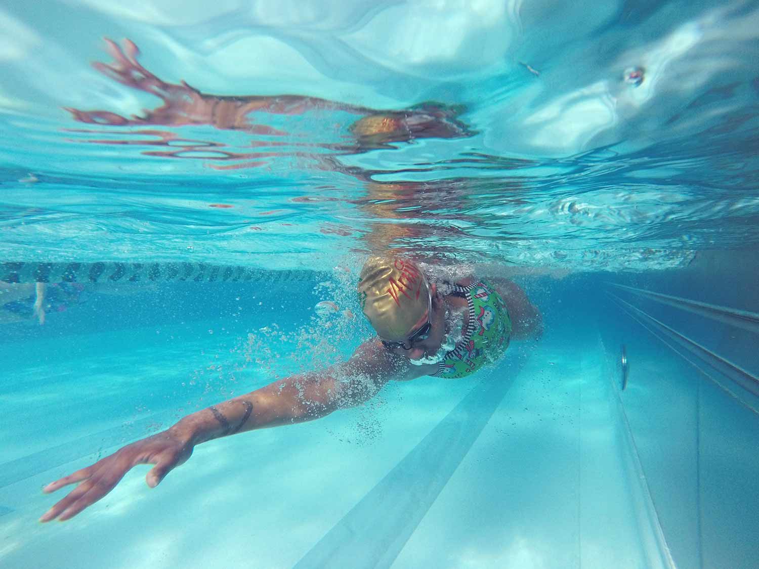 Person swimming laps at FFC.