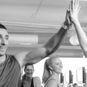 People giving high fives at at fitness bootcamp class
