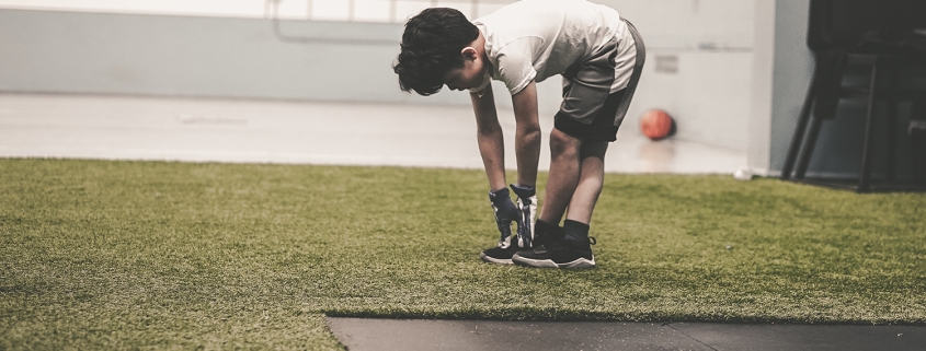 male child working out at the gym