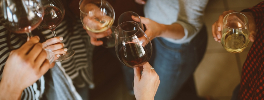 Friends cheering with wine glasses
