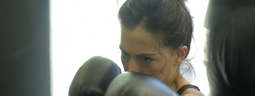 Woman with boxing gloves on