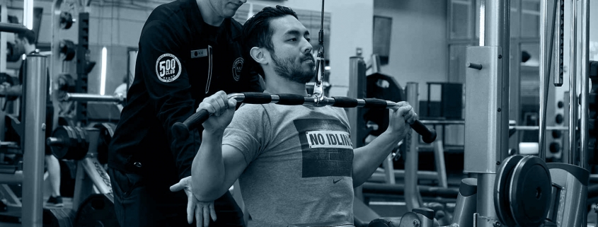 Member being trained by an FFC personal trainer.