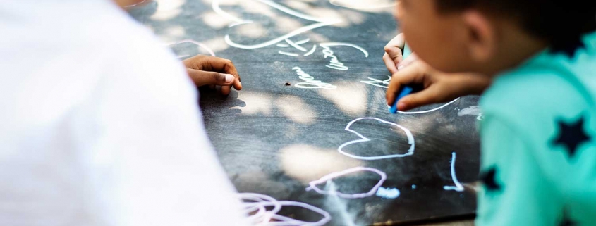Kids drawing with chalk
