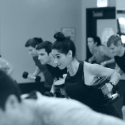 Members doing a high intensity workout with weights.