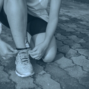 Runner tying shoelaces.
