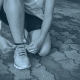 Runner tying shoelaces.