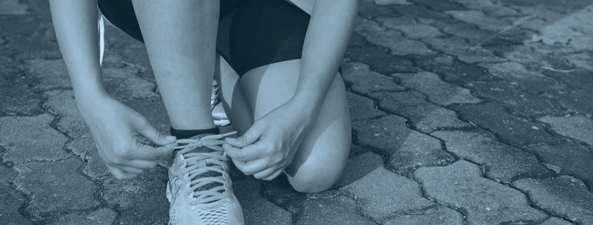 Runner tying shoelaces.