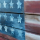Texture of american flag painted over woodboard