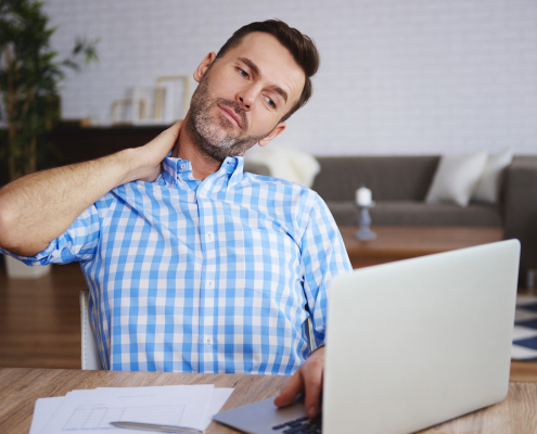 Mature entrepreneur suffering from neck pain