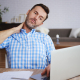 Mature entrepreneur suffering from neck pain