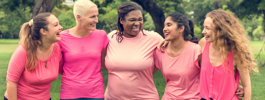 Group of diverse women wearing pink