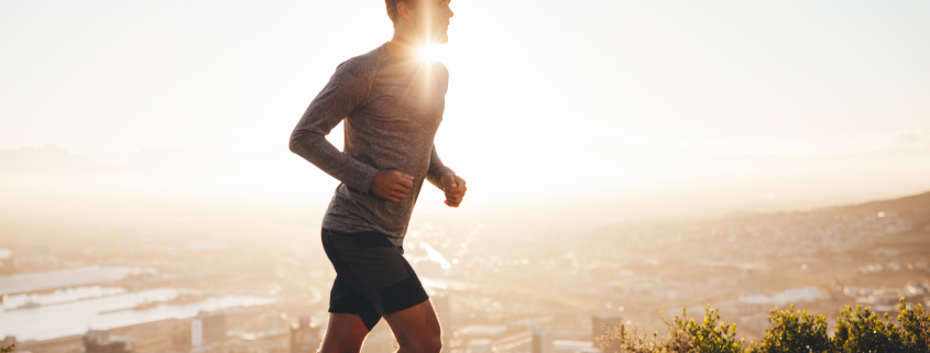 Man running outside in the sunshine
