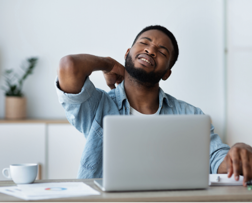 Golf ball on tee with blue sky above