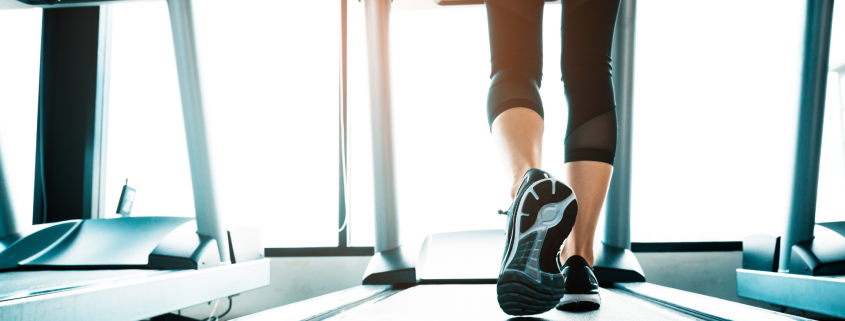 Woman walking on a treadmill
