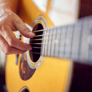Closeup Photo of Acoustic Guitar