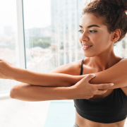 Woman stretching her triceps.