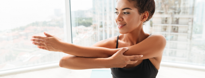 Woman stretching her triceps.