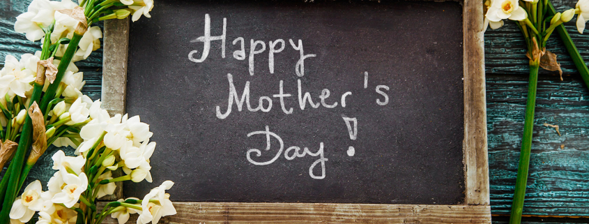 Mother's day. Narcissus flowers with card. Spring flowers