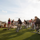 People on spin bikes taking a class on the FFC Gold Coast rooftop turf area.