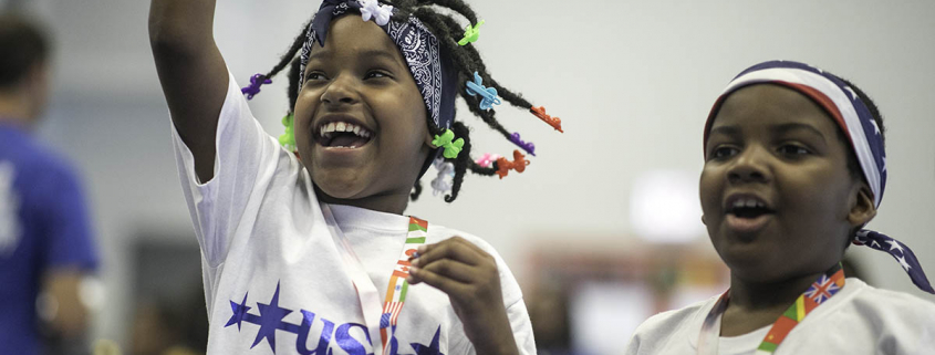 Photo of two young girls smiling and having fun