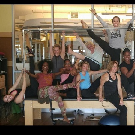 Group of wmoen on a Pilates reformer