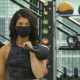 Woman holding a kettlebell at her shoulder
