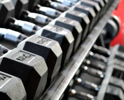 Dumbbells on a weight rack in a gym