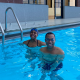 Juan and trainer Joy smiling in the pool