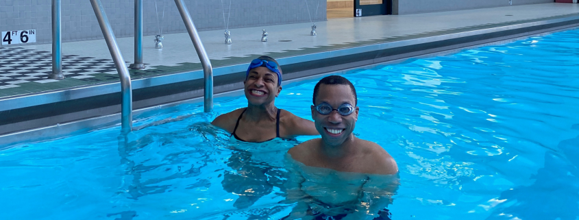 Juan and trainer Joy smiling in the pool