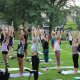 People in mountain pose in an outdoor yoga class