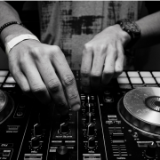 A pair of hand using DJ equipment