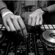 A pair of hand using DJ equipment