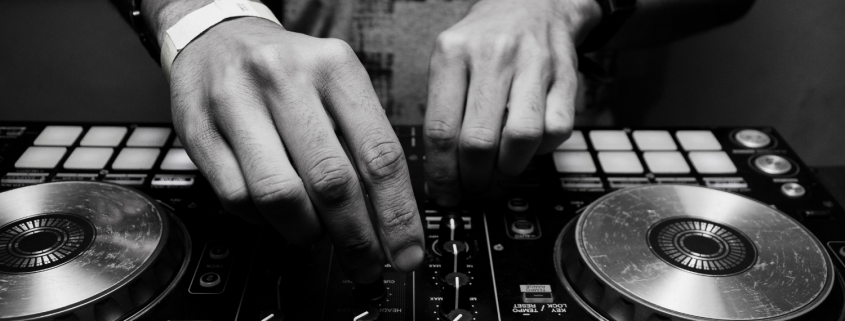 A pair of hand using DJ equipment