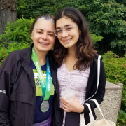 FFC Member Renu Kulkarni standing outside with her daughter.