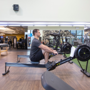Man on rowing machine at the gym