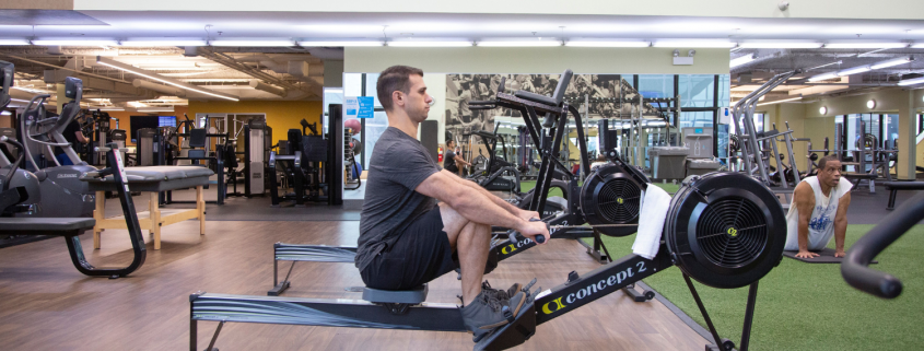 Man on rowing machine at the gym