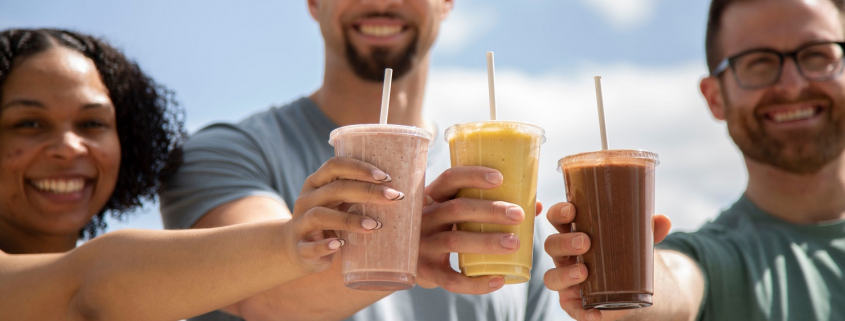 Three FFC employees drinking smoothies