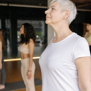 Woman standing in Mountain Pose in Yoga Class