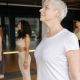 Woman standing in Mountain Pose in Yoga Class
