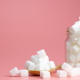 Sugar cubes on a pink background