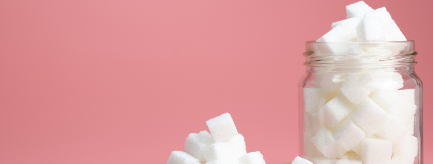 Sugar cubes on a pink background