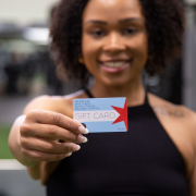 Woman holding a FFC gift card