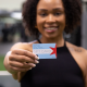 Woman holding a FFC gift card