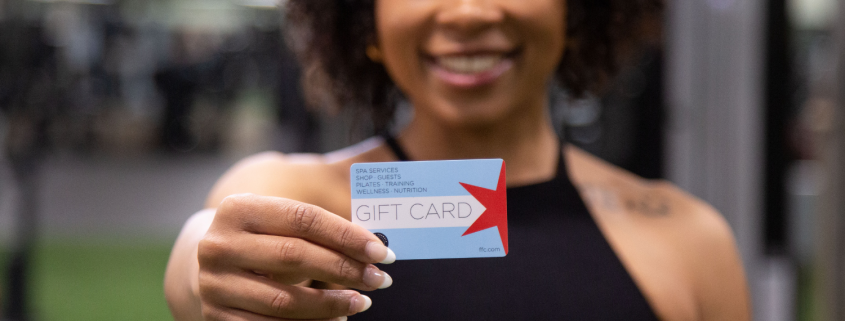 Woman holding a FFC gift card