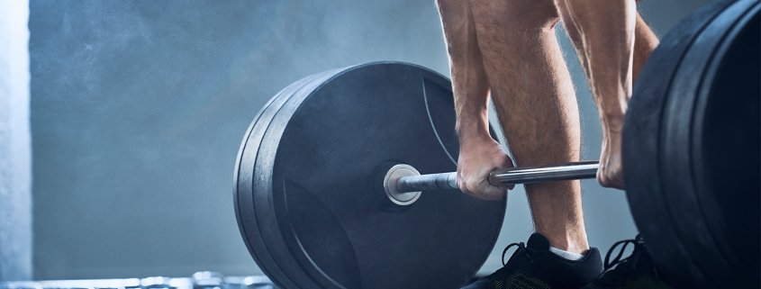 A man lifting heavy weight