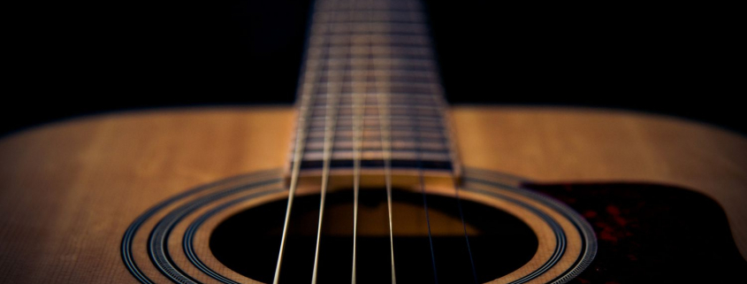 A guitar highlighting the strings