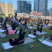 A group of members taking an outdoor class at the FFC Lincoln Park turf