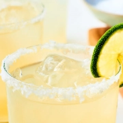 A margarita with a lime and salt on the rim