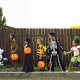 a group of children trick or treating during Halloween