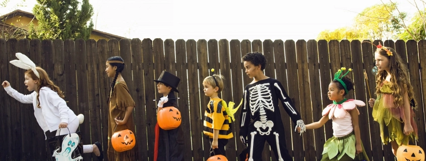 a group of children trick or treating during Halloween